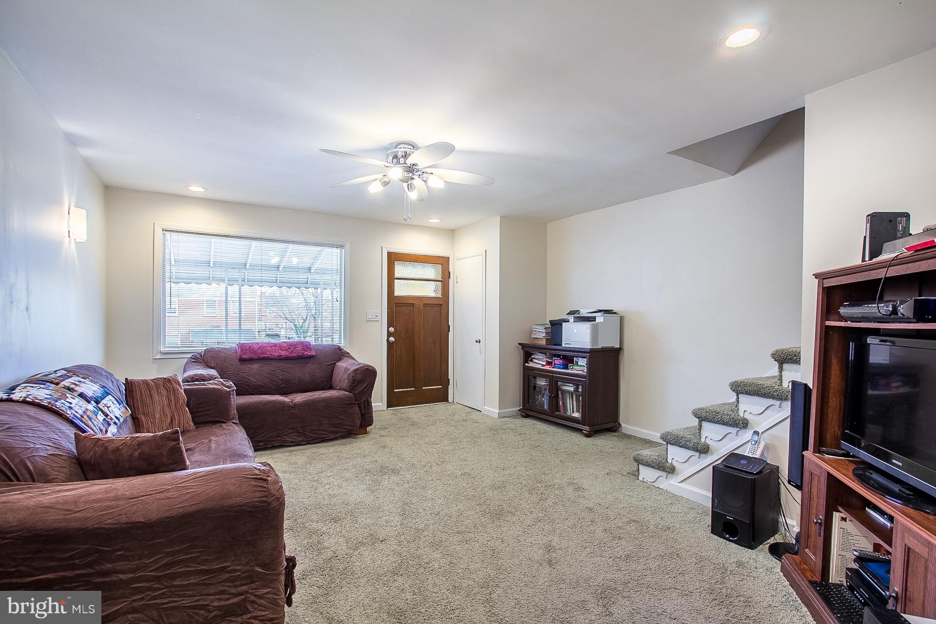 4444 Fenor Road Baltimore, MD 21227 - Photo 4 of 26 a living room with furniture and a fireplace