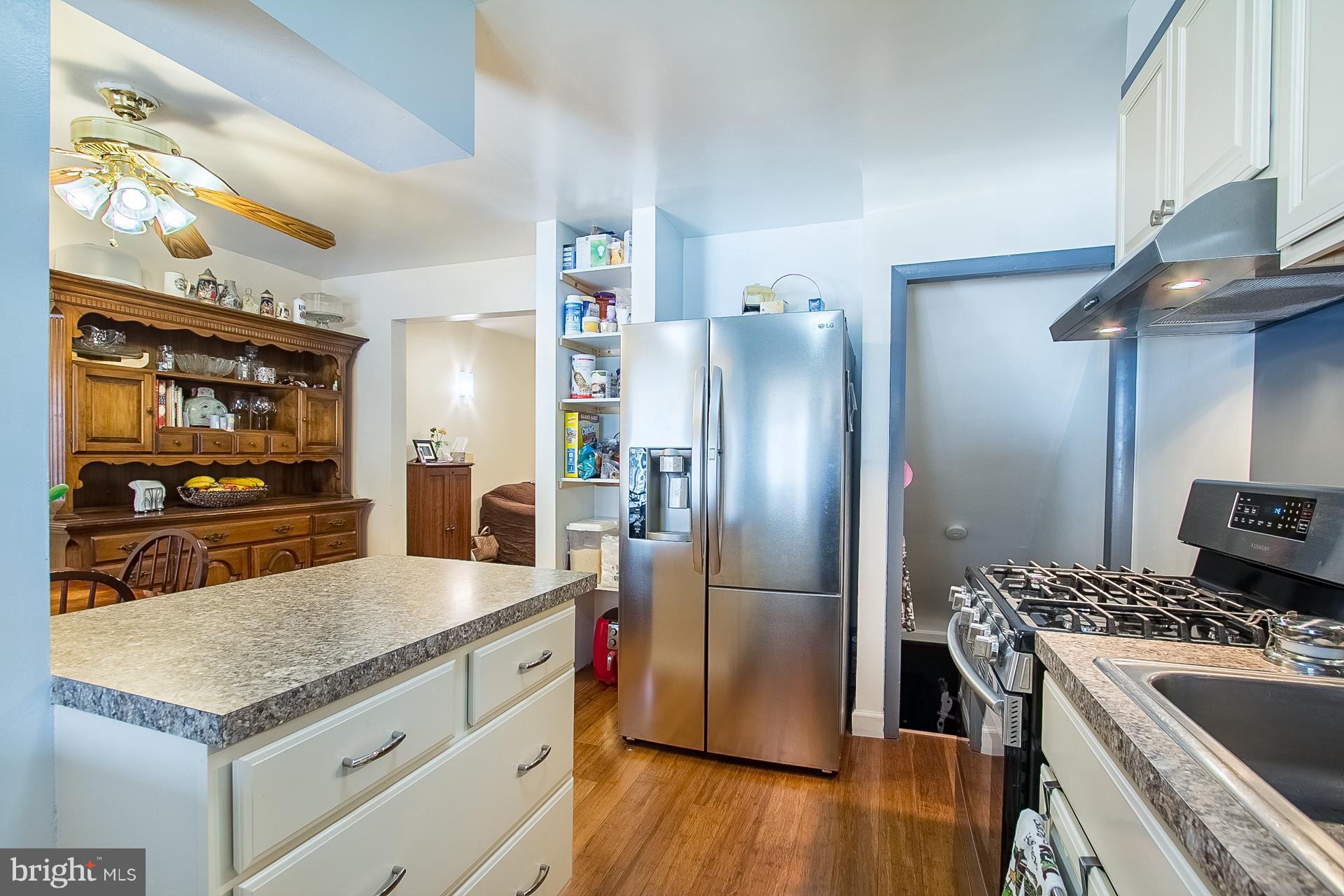 4444 Fenor Road Baltimore, MD 21227 - Photo 8 of 26 a kitchen with stainless steel appliances granite countertop a refrigerator and a stove