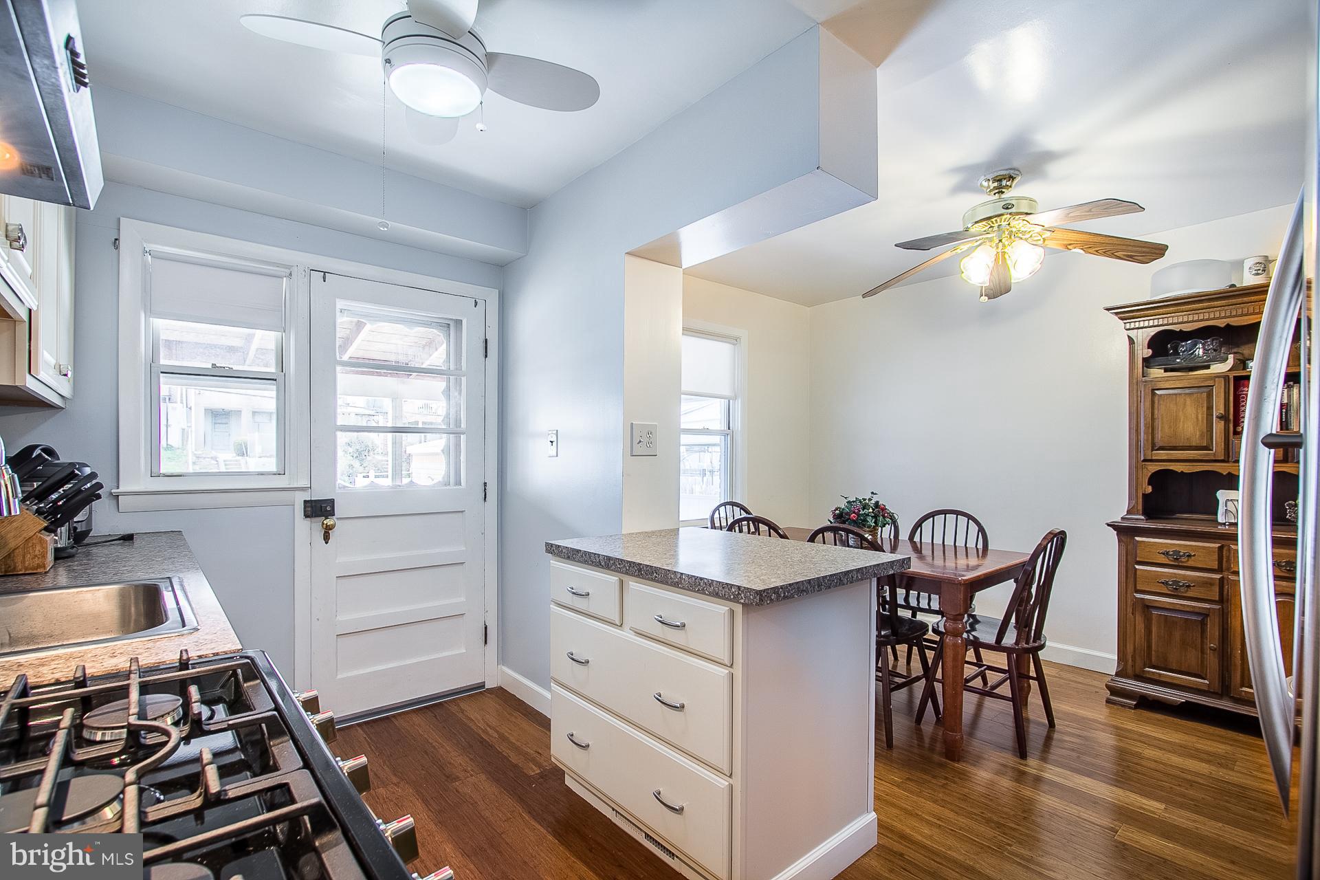 4444 Fenor Road Baltimore, MD 21227 - Photo 9 of 26 a kitchen with stove and cabinets