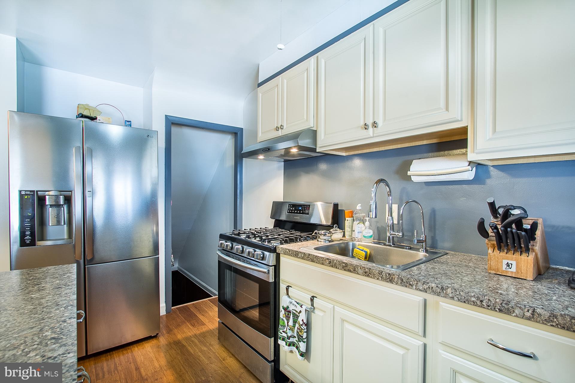 4444 Fenor Road Baltimore, MD 21227 - Photo 10 of 26 a kitchen with stainless steel appliances granite countertop a refrigerator a stove and a sink