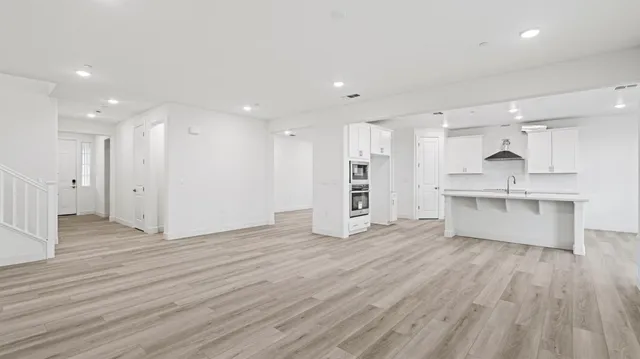 a view of kitchen with wooden floor