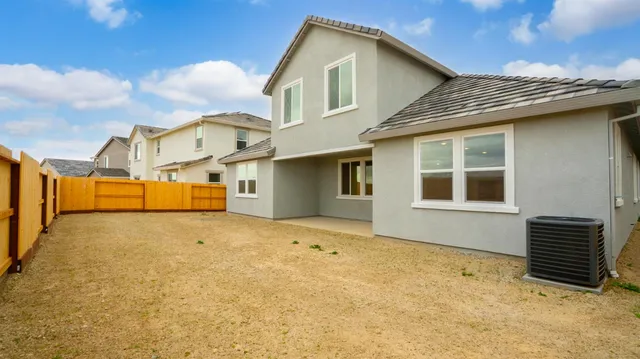 a front view of a house with a many windows