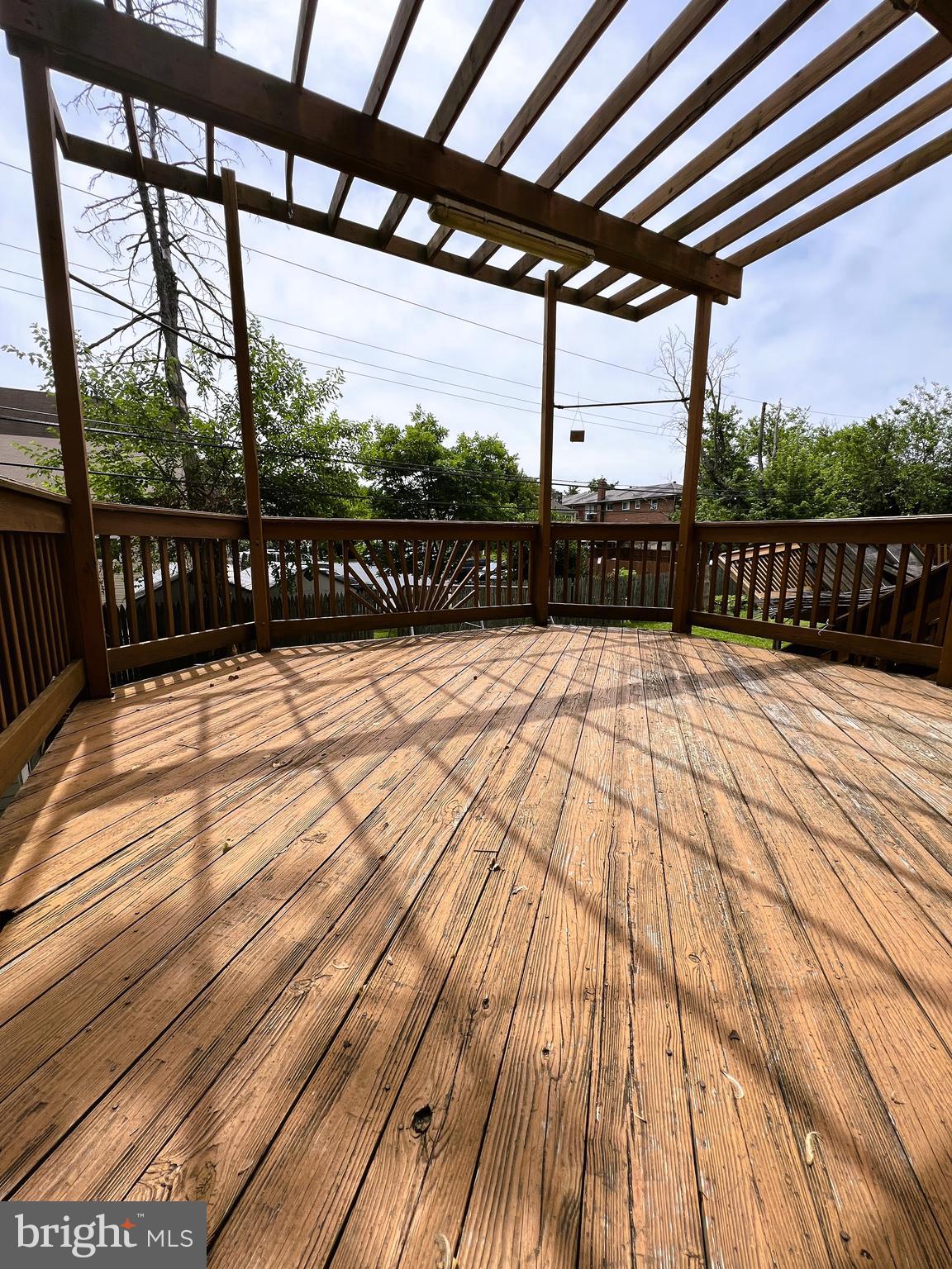 3705 Bancroft Road Baltimore, MD 21215 - Photo 42 of 50 a view of balcony with floor to ceiling windows with wooden floor