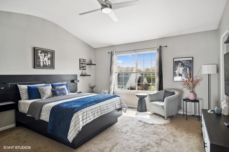 440 Spaulding Road Bartlett, IL 60103 - Photo 12 of 27 a bedroom with bed and a large window