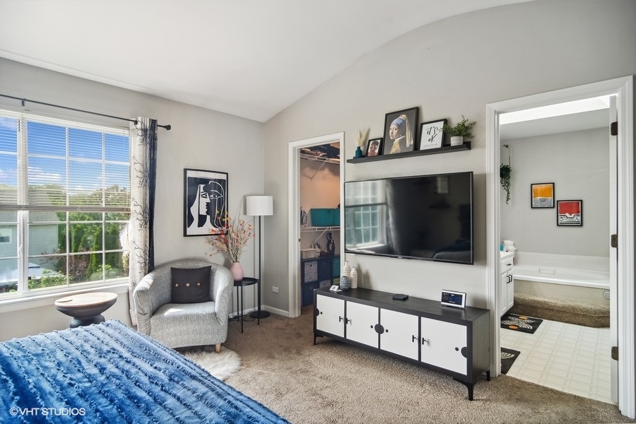 440 Spaulding Road Bartlett, IL 60103 - Photo 13 of 27 a living room with furniture and a flat screen tv