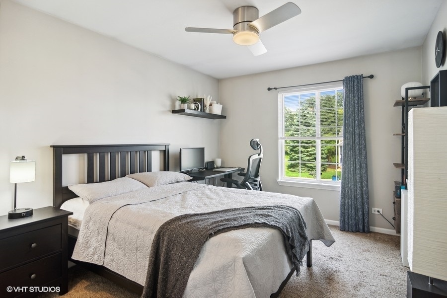 440 Spaulding Road Bartlett, IL 60103 - Photo 15 of 27 a bed sitting in a bedroom next to a window