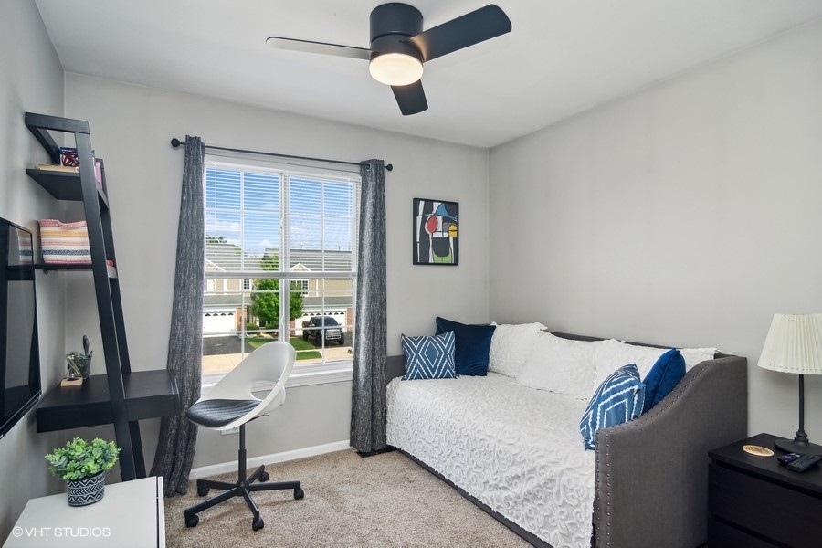 440 Spaulding Road Bartlett, IL 60103 - Photo 16 of 27 a bedroom with furniture and a window