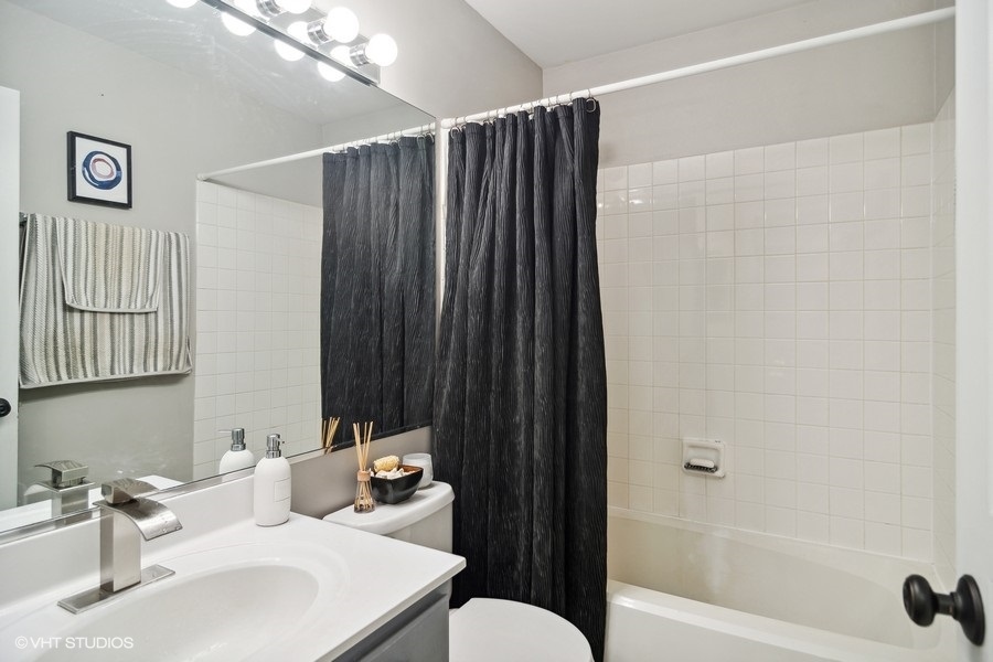 440 Spaulding Road Bartlett, IL 60103 - Photo 17 of 27 a bathroom with a sink and a mirror