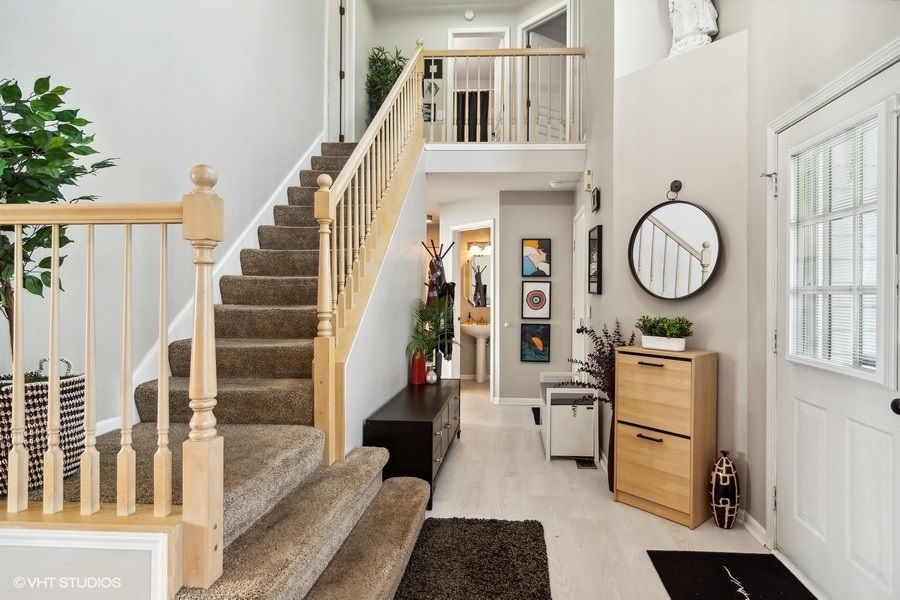440 Spaulding Road Bartlett, IL 60103 - Photo 3 of 27 a view of entryway and hall with wooden floor