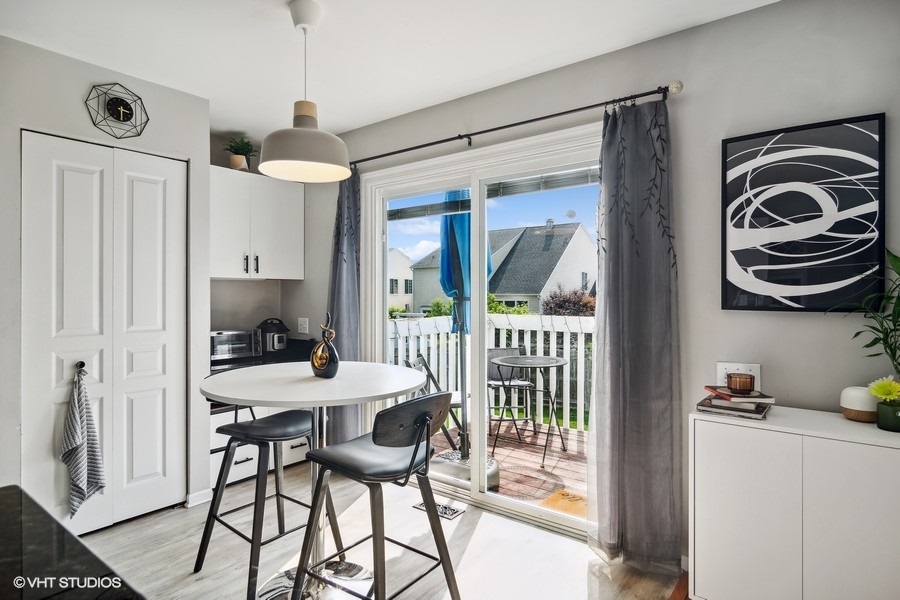 440 Spaulding Road Bartlett, IL 60103 - Photo 7 of 27 a view of a dining room with furniture window and wooden floor