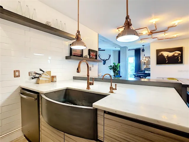 a living room with furniture and a wall painting