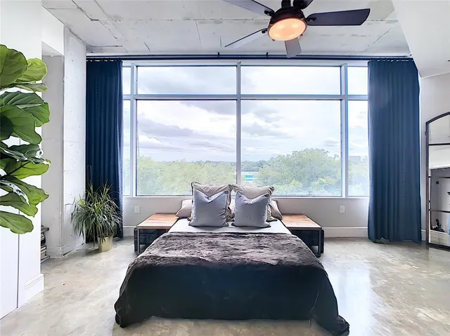 a view of a patio with table and chairs and potted plants