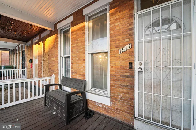 a view of balcony with wooden floor