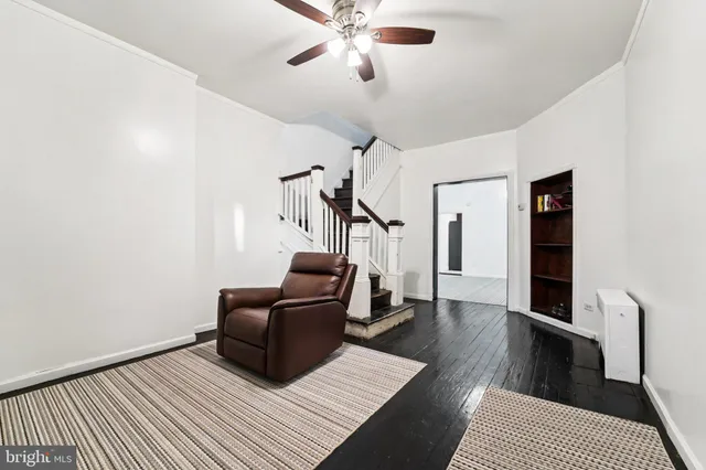 a living room with furniture and a rug