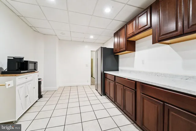 a kitchen with stainless steel appliances a sink and cabinets