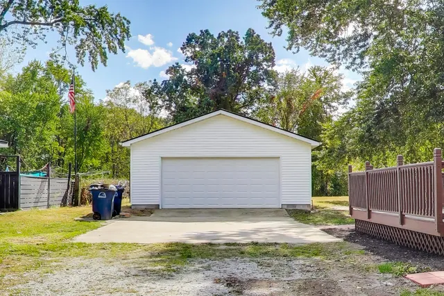 a view of a backyard of the house