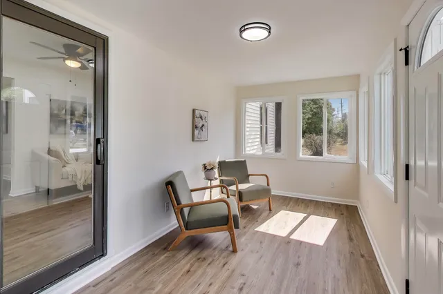 a living room with furniture and a window