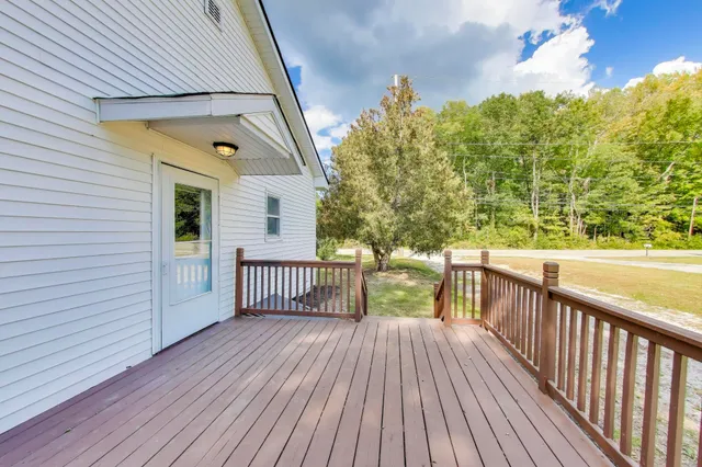 a view of a balcony with wooden floor