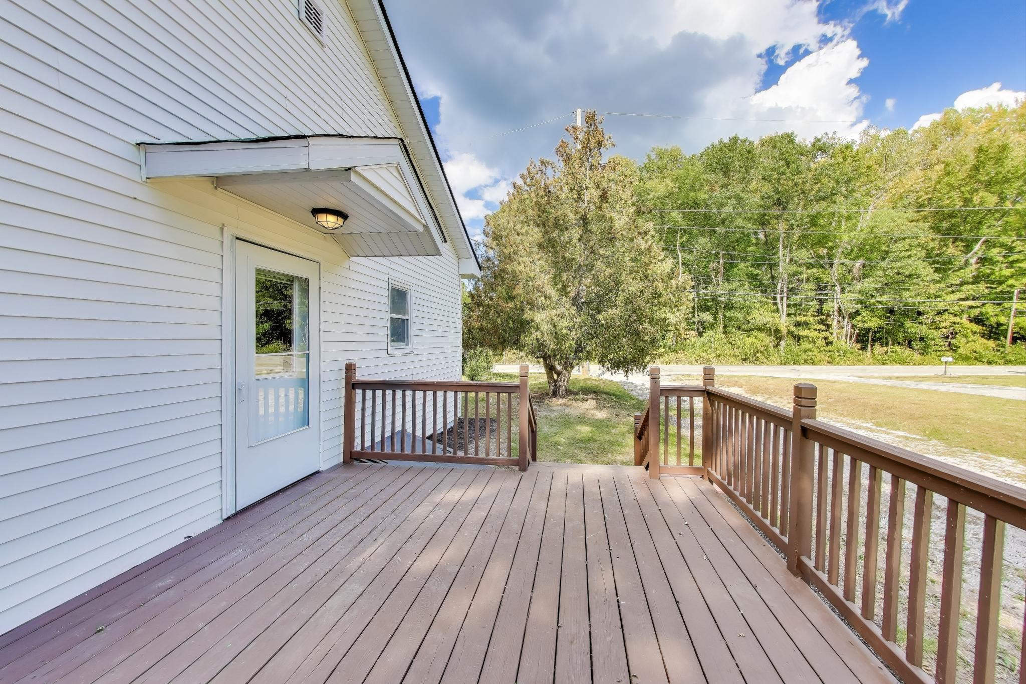 102 South Karwick Road Michigan City, IN 46360 - Photo 21 of 30 a view of a balcony with wooden floor