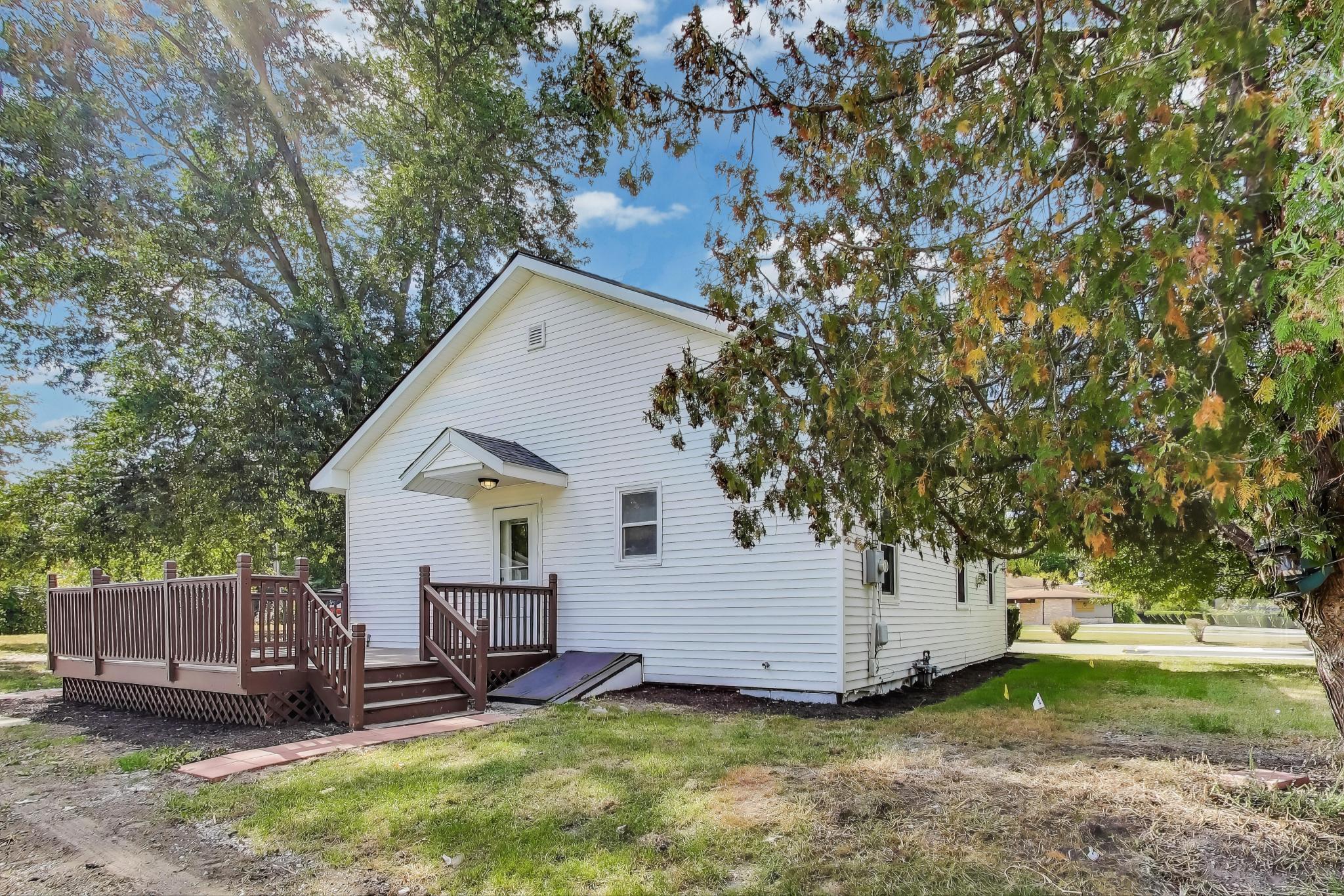 102 South Karwick Road Michigan City, IN 46360 - Photo 25 of 30 a view of a house with a yard and wooden fence