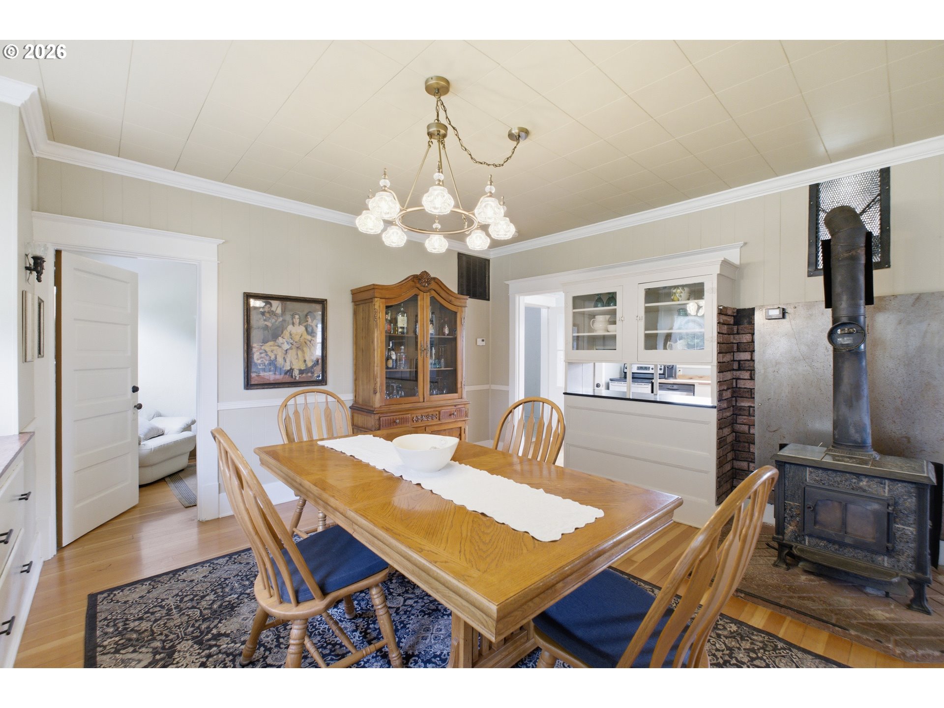2862 Matheny Road Northeast Gervais, OR 97026 - Photo 11 of 47 a dining room with wooden floor and chandelier