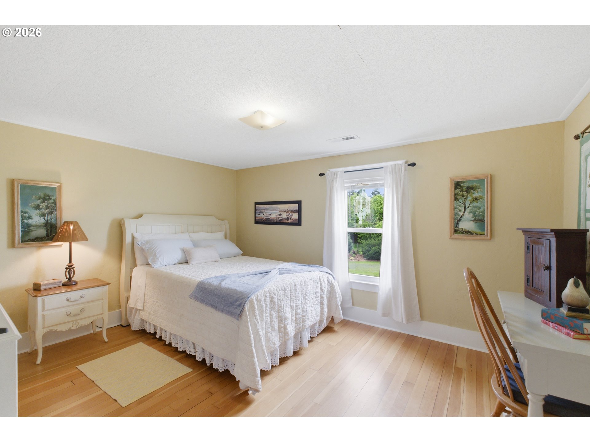 2862 Matheny Road Northeast Gervais, OR 97026 - Photo 23 of 47 a bedroom with a bed and a table in it