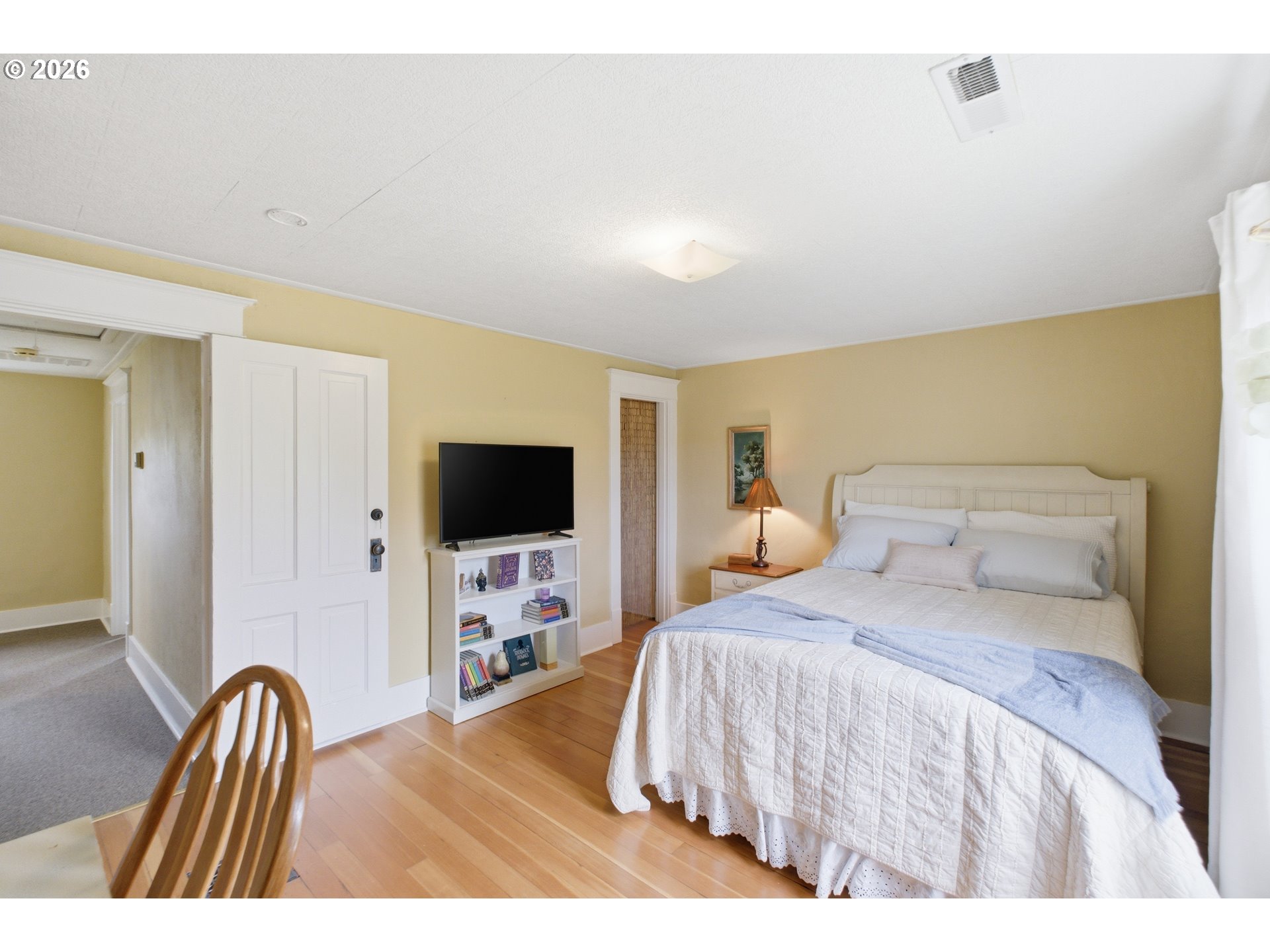 2862 Matheny Road Northeast Gervais, OR 97026 - Photo 24 of 47 a bedroom with a bed and a flat screen tv