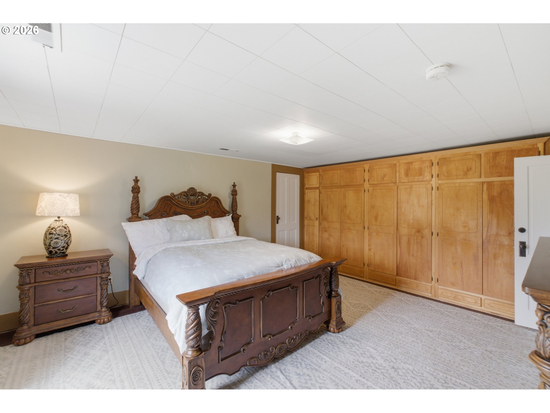 2862 Matheny Road Northeast Gervais, OR 97026 - Photo 25 of 47 a bedroom with a bed a dresser and a window