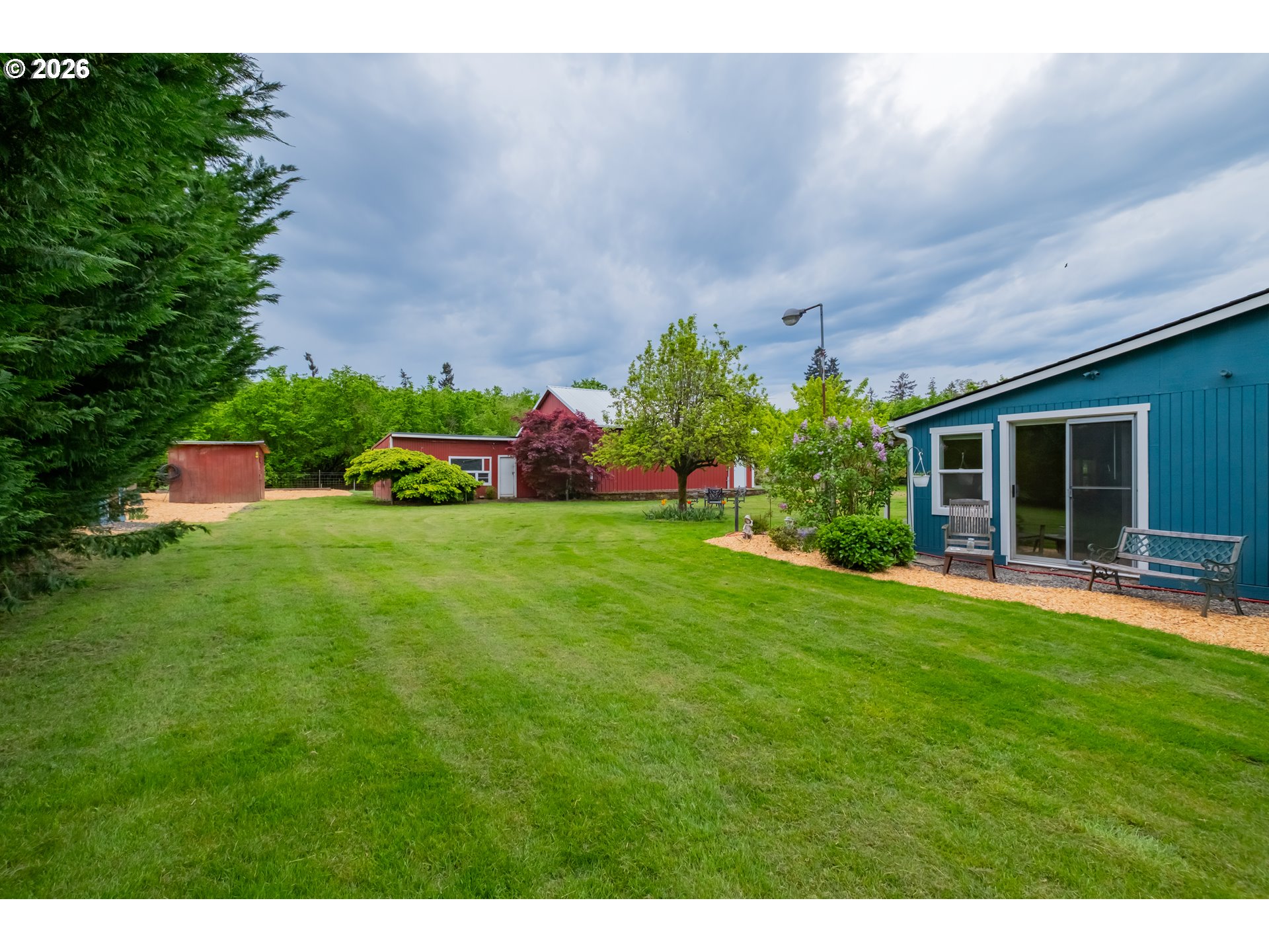 2862 Matheny Road Northeast Gervais, OR 97026 - Photo 32 of 47 a view of an house with backyard space and garden