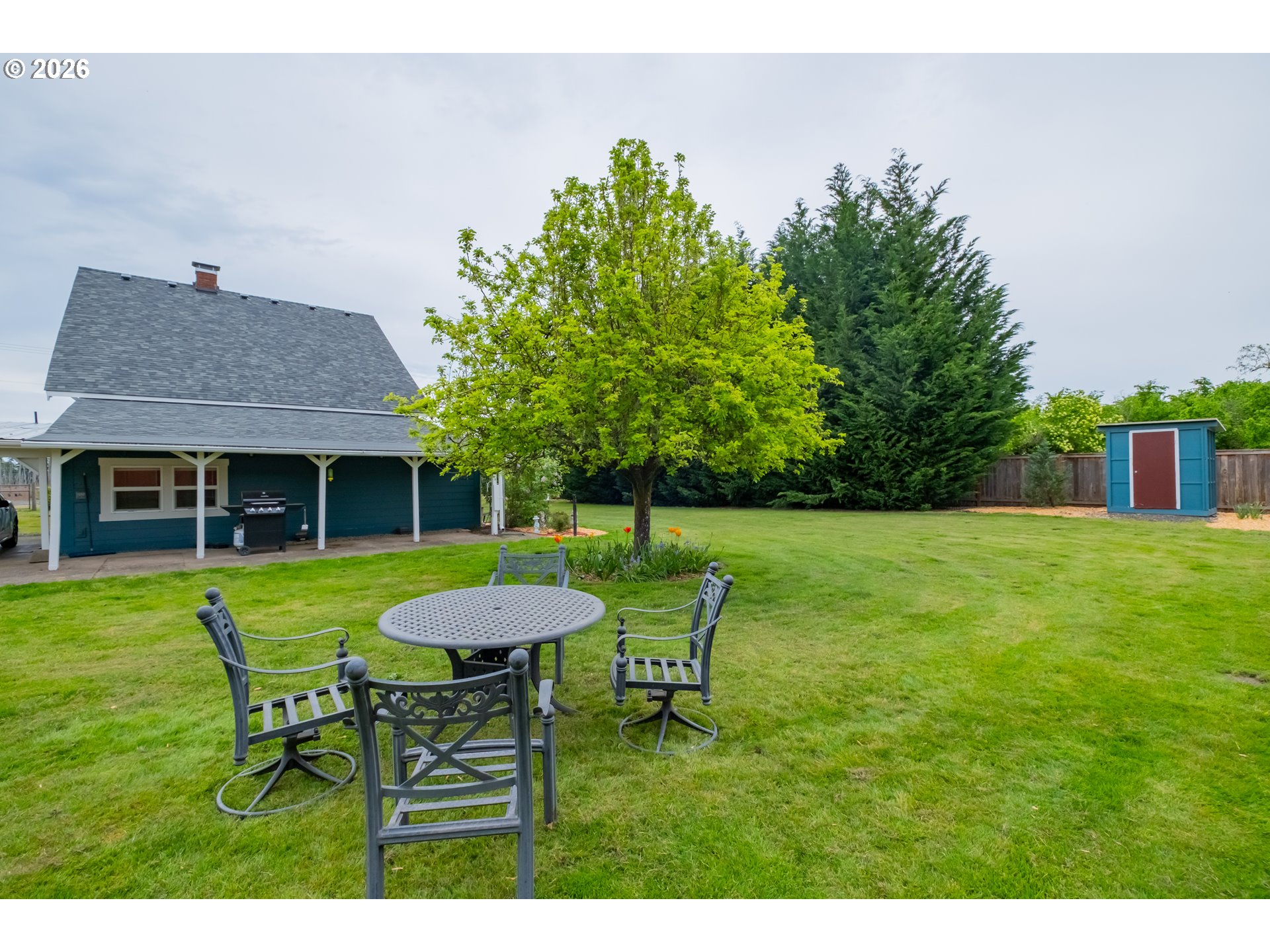 2862 Matheny Road Northeast Gervais, OR 97026 - Photo 36 of 47 a view of a house with a yard and sitting area