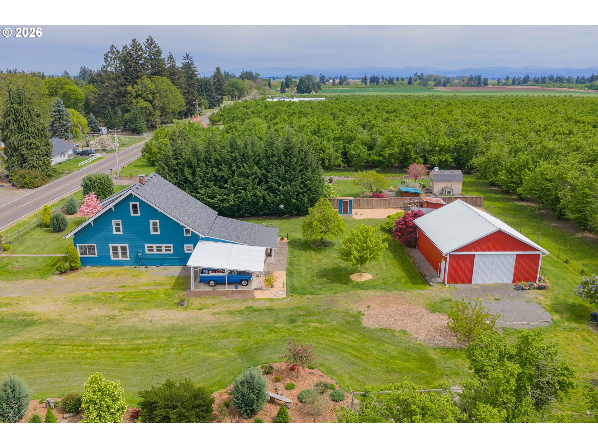 2862 Matheny Road Northeast Gervais, OR 97026 - Photo 41 of 47 a view of a big house with a big yard and large trees