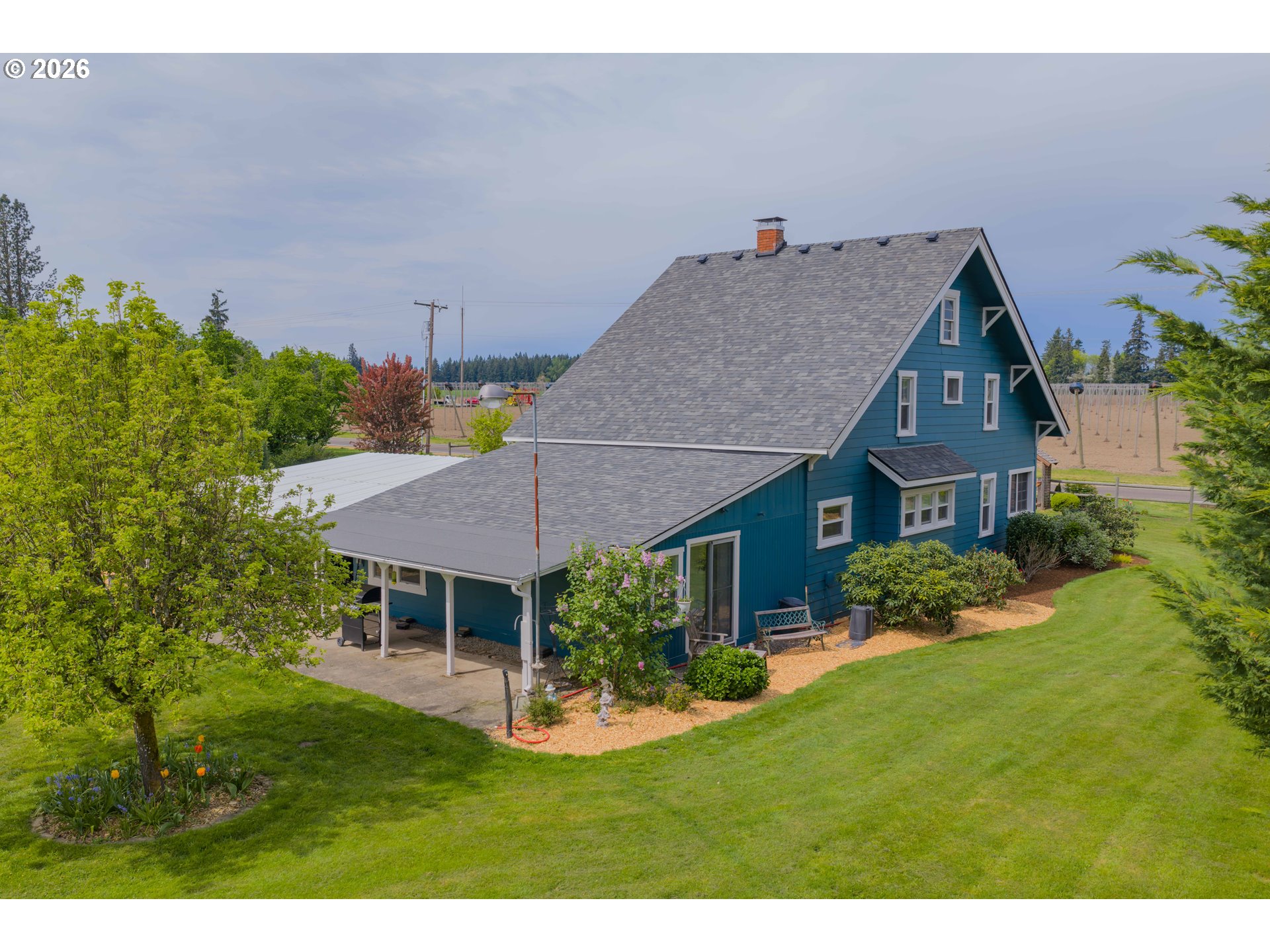 2862 Matheny Road Northeast Gervais, OR 97026 - Photo 43 of 47 a aerial view of a house with table and chairs under an umbrella