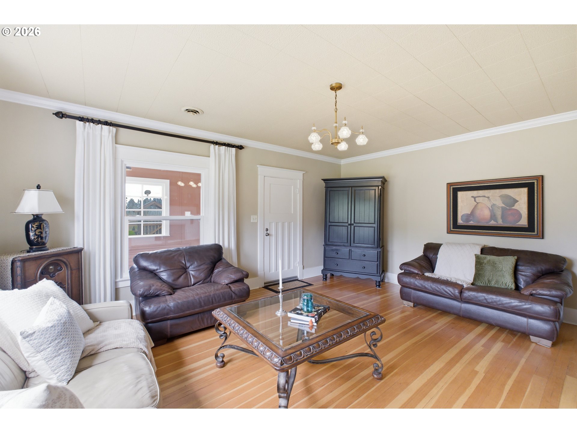 2862 Matheny Road Northeast Gervais, OR 97026 - Photo 7 of 47 a living room with furniture and a chandelier
