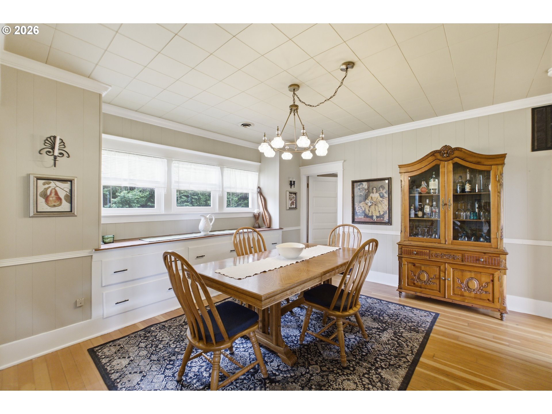 2862 Matheny Road Northeast Gervais, OR 97026 - Photo 10 of 47 a view of a dining room with furniture a chandelier and wooden floor