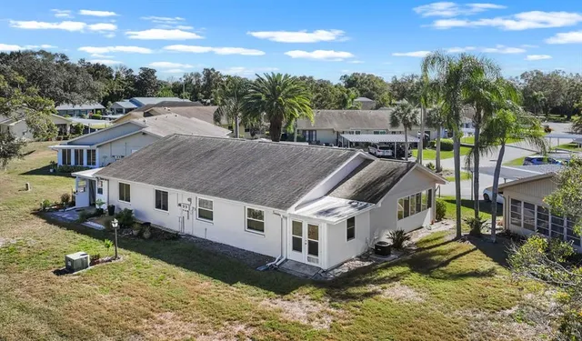 an aerial view of houses with outdoor space