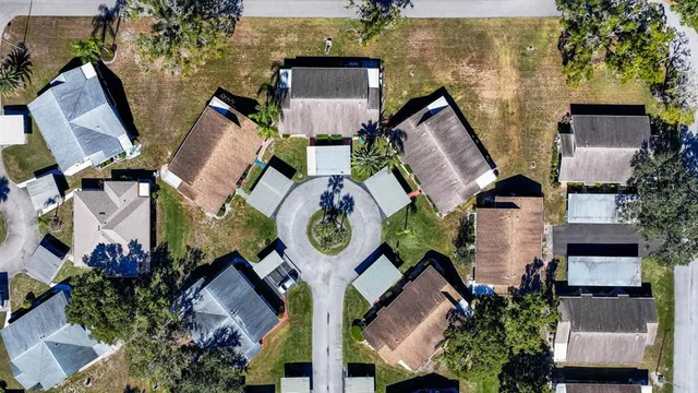 an aerial view of a house with outdoor space