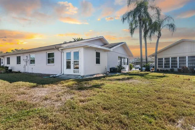 a view of a street with a building and a street sign