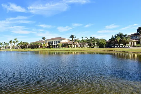 a view of a lake with outdoor seating space