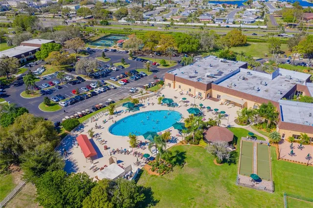 an aerial view of a house with a swimming pool yard and outdoor seating
