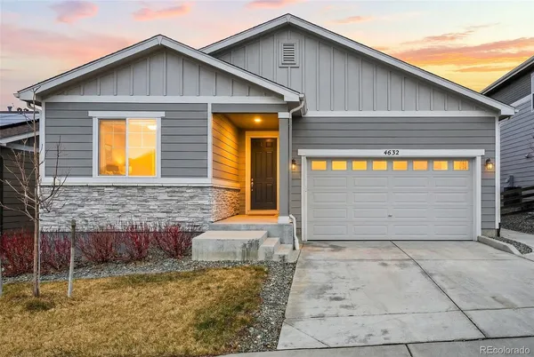 a front view of a house with garage