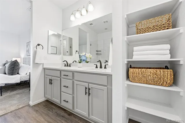 a spacious bathroom with a double vanity sink and a mirror