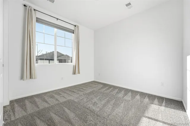 an empty room with window