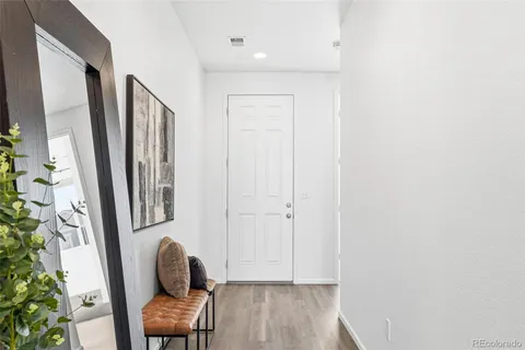 a room with wooden furniture and wooden floor