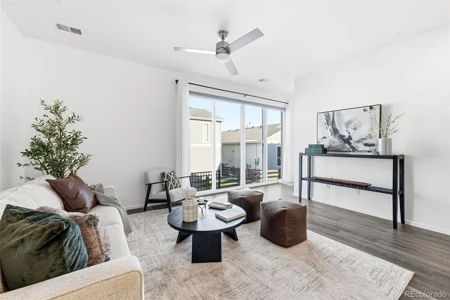 a living room with furniture rug and window