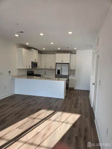 a kitchen with a sink and a window