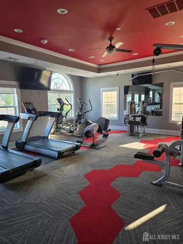a view of a hallway with wooden floor and entryway