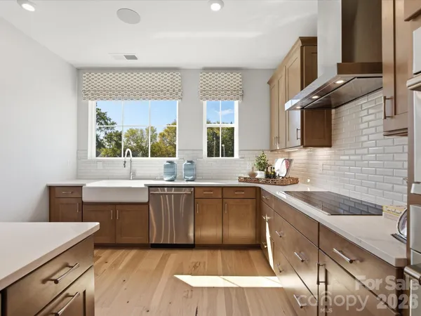 a kitchen with a sink stove and cabinets