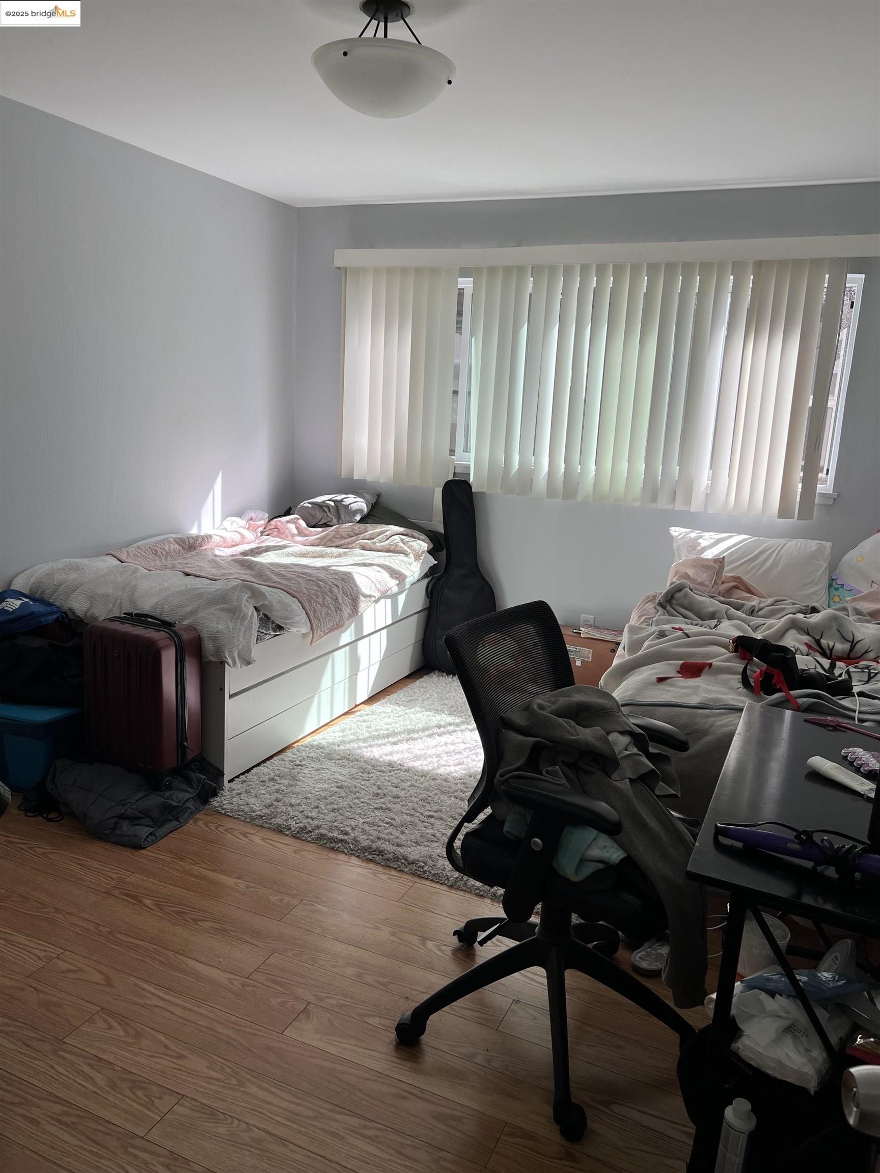 2636 Warring Street, Unit 305 Berkeley, CA 94704 - Photo 4 of 8 a living room with furniture and a window