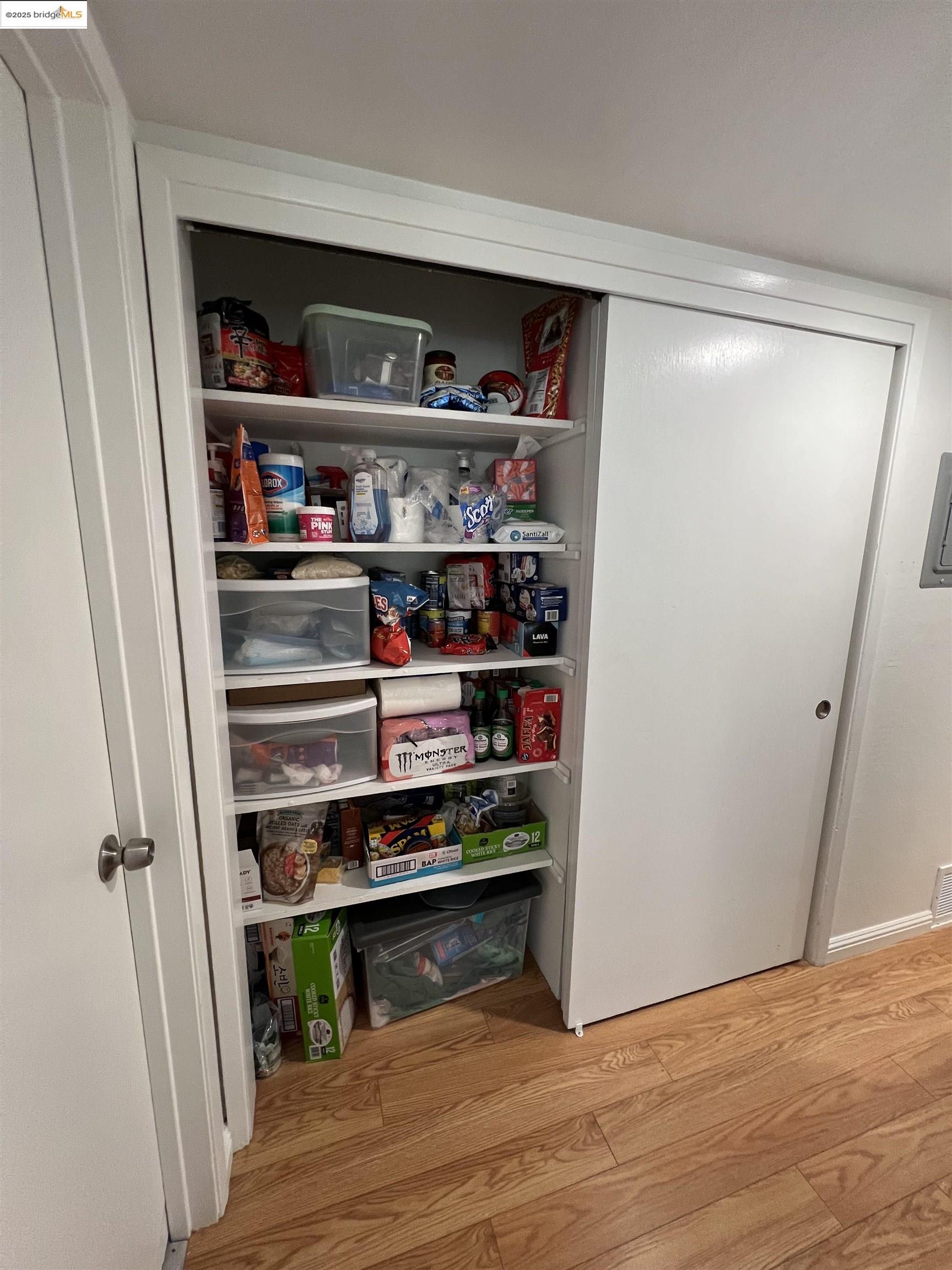 2636 Warring Street, Unit 305 Berkeley, CA 94704 - Photo 6 of 8 a shelf with cup and plates