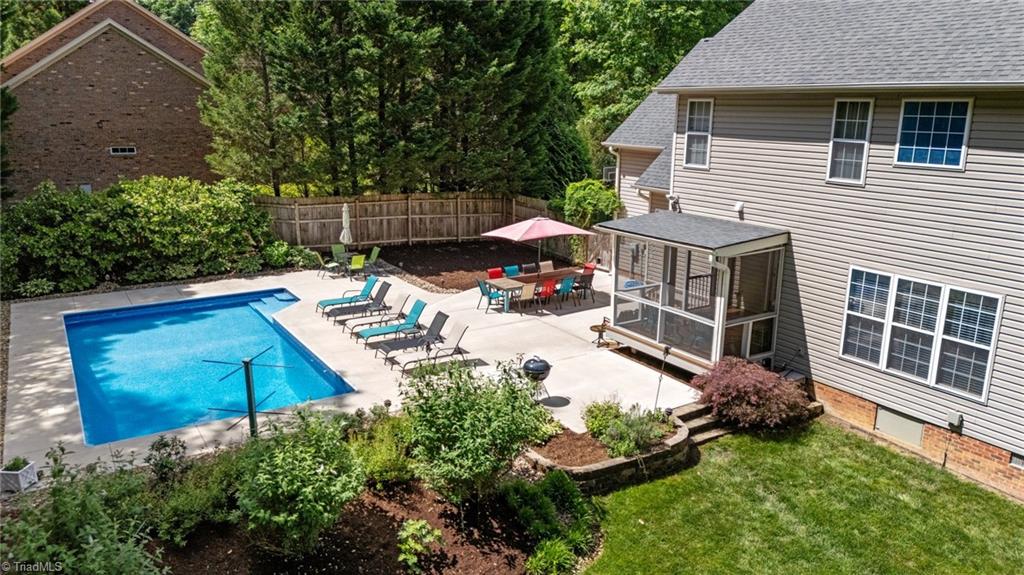 7812 Wilson Farm Road Summerfield, NC 27358 - Photo 3 of 50 Heated saltwater pool w/ color changing LED lights and tanning ledge